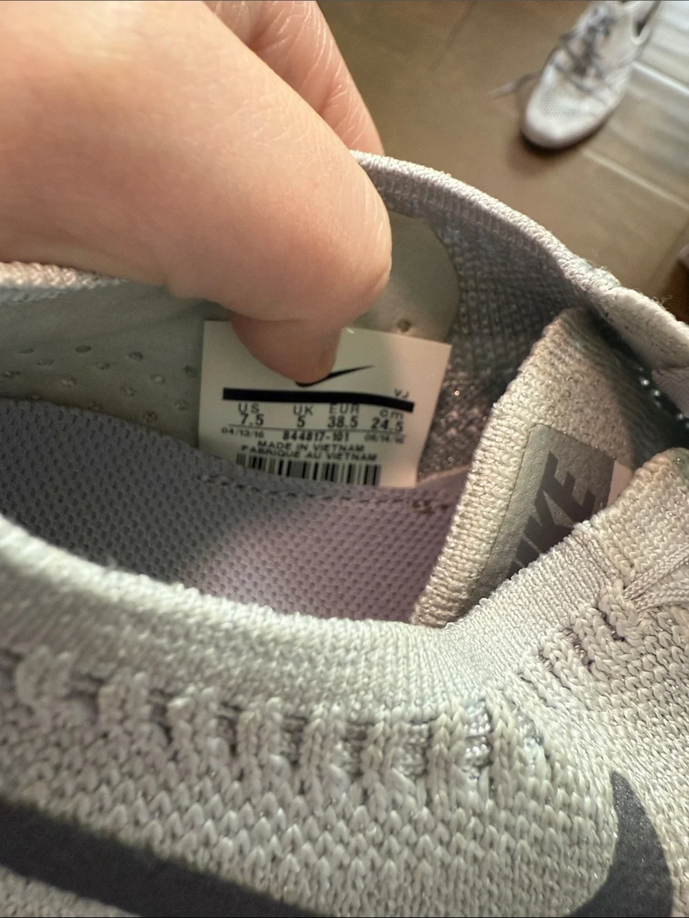 Nike Women's Light Gray Flyknit Training Sneakers